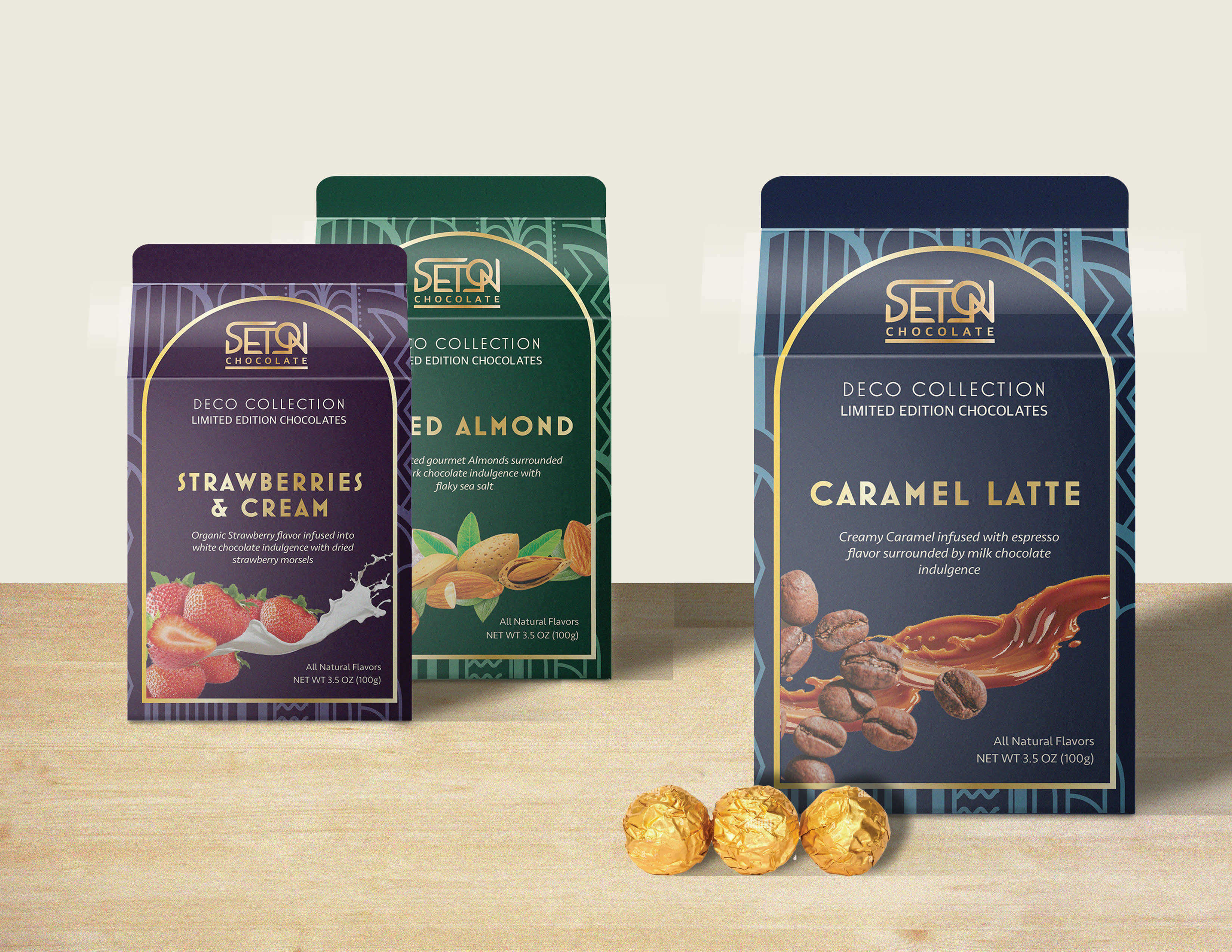 The three flavor variations are seen, in blue, purple, and green packaging, respectively, with small round gold chocolates.